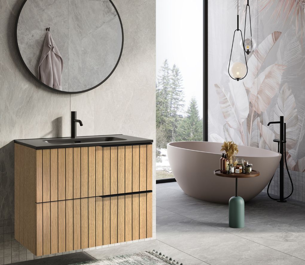 okrągłe czarne lustro w łazience oraz drewniana szafka podumywalkowa z czarną armaturą